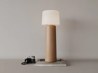 Table Lamp With Wooden Cylinder Base And White Shade Beside Vintage Camera And Magazine 3d model