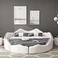 Round White Double Bed in Bedroom with Gray Wall Framed Pictures and Pendant Lights