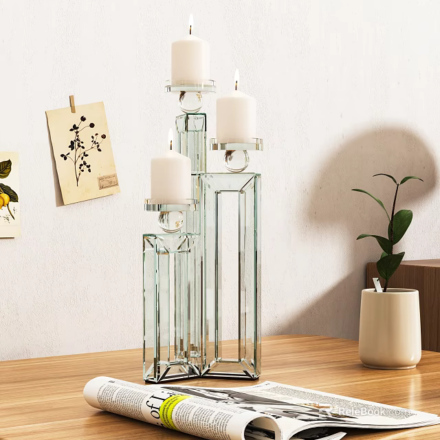 Modern Decorative Ornament Set With Glass Candle Holders Candles On Wooden Tabletop And Green Plant 3d model 