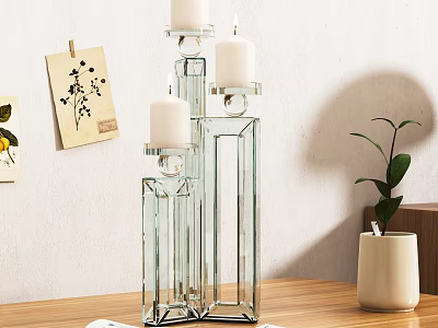 Modern Decorative Ornament Set With Glass Candle Holders Candles On Wooden Tabletop And Green Plant 3d model