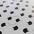 White Marble Floor Tiles With Black Crescent Patterns And Geometric Design