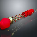 Shiny Red Decorative Ornament With Gold Chain And Multiple Linked Red Parts