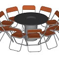 Round Dining Table with Gray Tabletop Central Hole Surrounded by Eight Orange Metal Frame Chairs