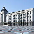 Classical Office Building With Domed Tower Gray Stone Facade Multiple Paned Windows And Geometric Square