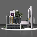 Stylish Window Display with White Racks Hanging Clothes Green Plants and Brand Logo