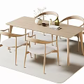 Modern Minimalist Dining Table With Four Light Wooden Chairs And Decorative Pieces On Beige Rug