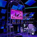 VOGUE Modern Exhibition Space With Illuminated Staircase And Blue Lighting Interior
