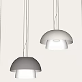 Two Dome Shaped Modern Pendant Lights Textured Shades With White Illuminated Light Against Minimalist Gray Wall