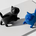 Black and Blue Cat Dolls Standing on White Surface with Playful Poses