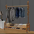 Golden Metal Clothing Rack With Hanging Shirts Jeans Folded Clothes And Shoes In Bedroom