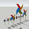 Colorful Commercial Decorative Pinwheels And Flower Shaped Ornaments In Various Sizes On Poles