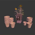 Sunflower Plant In Brown Pot With Stacked Terracotta Pots Of Various Sizes