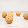 Scattered Basketballs As Sports Equipment On Light Wooden Floor With White Wall