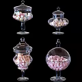 Colorful Marshmallows Stored in Clear Glass Jars With Various Shapes