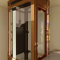 Modern Elevator with Glass Door and Brass Frame in Interior Space Alongside Staircase