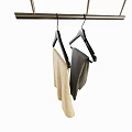 Black Hangers Hanging on Metal Rod with Beige and Gray Clothes