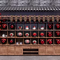 Traditional Wine Display Cabinet With Red Lanterns And Brick Wall Background