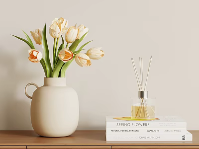 White Ceramic Vase With Cream And Orange Tulips Next To Reed Diffuser And Stacked Books 3d model