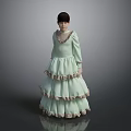 Young Girl In Light Green Layered Dress With Lace Collar Standing On Gray Background