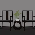 Modern Dark Wood Armchairs With Light Seats And Round Table With Green Plant