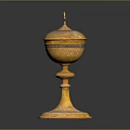 Yellow Carved Sculpture Vessel With Intricate Patterns And Cross Topped Lid On Pedestal Base