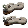 Modern Cream Curved Sectional Sofa With Decorative Pillows And Side Table Plant