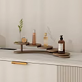 Wooden Multi Tiered Shelf with Toiletry Bottles Small Plant on White Countertop
