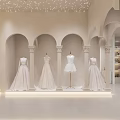 Modern Clothing Store Featuring Wedding Dress Red Gown Mannequins And Circular Archway