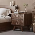 Wooden Nightstand with Circular Texture Drawers Books Headphones Small Plant Vase in Modern Bedroom