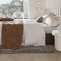 Modern Bedroom Interior With White Bed Brown Blanket And Round Nightstand