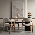 Modern Minimalist Table and Chair Set with White Vase Abstract Wall Art and Colorful Boxes