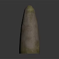 Carved Stone Sculpture With Spiral Patterns And Green Moss Covered Surface