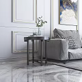 Elegant Side Table With Marble Top And Black Metal Legs Next To Gray Sofa