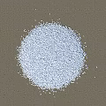 Small White Pebble Stones Scattered On Cracked Wooden Ground Surface
