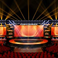 Spectacular Stage Design With Golden Lights Red Seats And Screens
