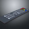Gray Remote Control Device With Multiple Colored Buttons And White Keys
