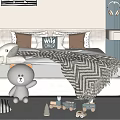 Cozy Kids Bed with Gray Teddy Bear Toy Train Striped Blanket and Wild Child Pillow