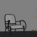 Modern Leisure Chair with Gray Cushion Black Armrests and Natural Light Tree Shadows