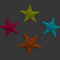 Four Colorful Starfish in Pink Green Orange and Blue on Black Background