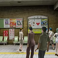 Busy Subway Station Interior With Seats Advertising Boards Escalator And People Walking