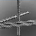 Stainless Steel Threaded Rods Arranged On Dark Background For Industrial Applications