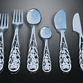Elegant Silverware Set With Intricate Floral Carved Handles And Mirror Finish