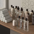 Stylish Display of Rolled Towels and Fragrance Bottles on Wooden Shelf