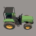 Green Agricultural Tractor With Black Cabin And Yellow Wheels Parked On Hay Field