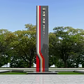 Tall Spiritual Fortress Column With Red And Gray Sections In Plaza Surrounded By Green Trees