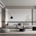 Modern Living Room Interior With Gray Sofa Black Floor Lamp Round Coffee Table And Pouf