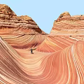 Red Rock Landscape With Wave Like Patterns And Standing Person Under Blue Sky 3d model