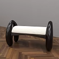 Modern Black Chaise Lounge With White Padded Seat And Curved Design On Herringbone Wooden Floor
