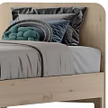 Single Bed with Wooden Frame Gray Sheets Blue Blanket Green Dark Pillows and Bedside Table