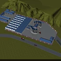 Industrial Factory with Multiple Buildings Blue Roofs Green Hills Grassland and Access Roads with Vehicles